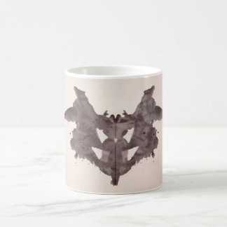 Die Rorschach Test-Tinte befleckt Schläger der Tasse