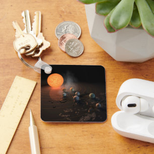 Die sieben Planeten von Trappist-1 sind im Orbit u Schlüsselanhänger