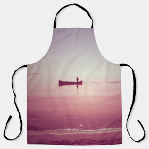Die Silhouette eines Fischers mit Boot auf dem Mee Schürze