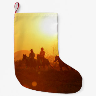 Die Silhouette eines Reiters in Cowboy-Outfit-Kost Kleiner Weihnachtsstrumpf