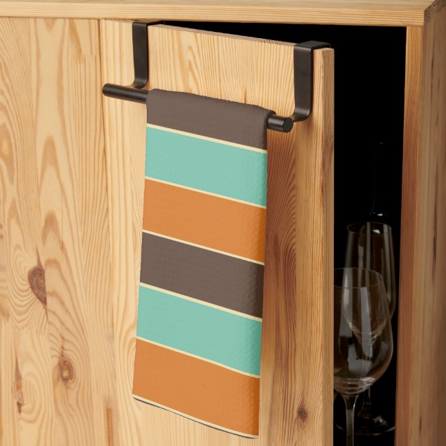 Die Streifen sind grün, schwarz und orange Geschirrtuch (Drittel gefaltet)