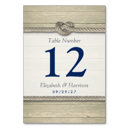 Die Tischnummer der Hochzeit am rustikalen Strand 