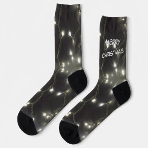 Die Weihnachtskruste brennt in Silberleuchten. Cre Socken