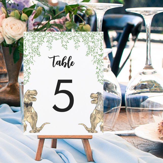 Dinosaur Theme Wedding Custom Tischnummer (Dinosaur themed wedding table numbers with T-Rex bride and groom and jungle foliage)
