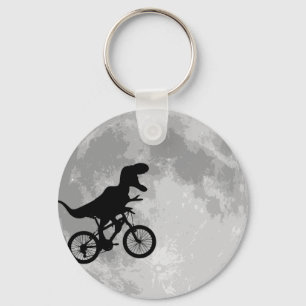 Dinosaurier auf einem Rad mit dem Mond Schlüsselanhänger