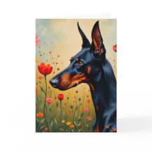 Doberman auf einem Gebiet der Blume