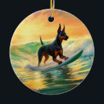 Doberman Beach Surfing Painting Keramik Ornament<br><div class="desc">Tauchen Sie ein in die spielerische Welt des Kaninchen-Abenteuers mit diesem faszinierenden Bild. Ein gepflegter Hund geht zu den Wellen und reitet geschickt auf einem sonnengeküssten Strand. Das lebendige Kunstwerk vereint wunderbar das Wesentliche der Erregung am Strand, während der Hund furchtlos auf den Wellen reitet und den Geist von Spaß...</div>