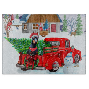 Doberman Dog in Christmas Delivery LKW Schnee Schneidebrett