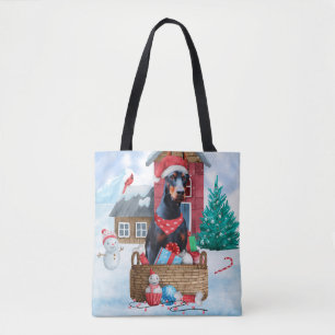 Doberman Hund im Schnee Weihnachtshundehaus