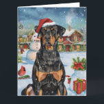 Doberman Winter Wonderland Christmas Joy Karte<br><div class="desc">Dieses festliche Design spiegelt den fröhlichen Geist der Urlaubssaison wider und besticht durch ein hübsches Jungtier mit einer Weihnachtsmannmütze. Der Hund ist eingebettet in ein winterliches Wunderland, mit einem Schneemann, einem dekorierten Weihnachtsbaum und wunderschön verpackten Geschenken. Schneeflocken fallen sanft ab und geben der Szene eine magische Touch, während die lebhaften...</div>