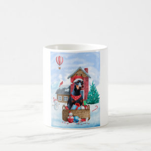 Dobermann-Hund im Schnee Weihnachtshundehaus Kaffeetasse