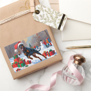 Dobermann läuft im Schnee mit Weihnachtsmütze Rechteckiger Aufkleber