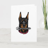 Dobermann mit Schraubenschlüssel