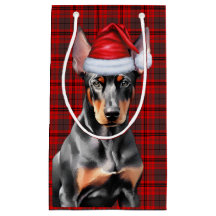 Dobermann Pinscher Hund und rotes Weihnachts-Karo