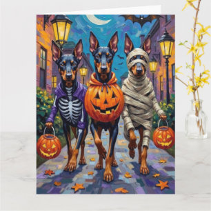 Dobermänner beim Trick-or-Treat an Halloween-Kostü Karte