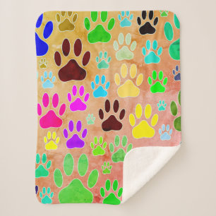 Dog Paw druckt auf Vintagem Hintergrund Sherpadecke