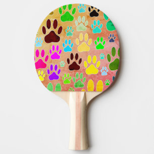Dog Paw druckt auf Vintagem Hintergrund Tischtennis Schläger