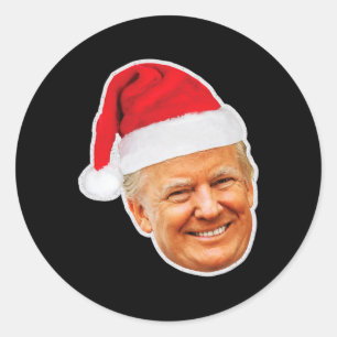 Donald Trump mit einem Weihnachtsmannhut Unterstüt Runder Aufkleber