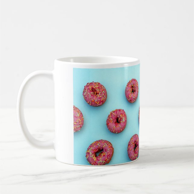 Donuts streuen auf Donuts rosa blaue, helle Tasse (Links)