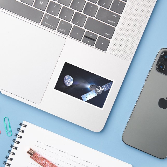 Dragon XL-Raumfahrzeug mit Planet Erde in der Fern Aufkleber (Laptop mit iPhone)