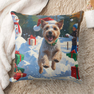 Drahthaar-Fox-Terrier läuft durch Schnee mit Weihn Kissen
