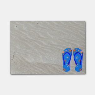 Drehen Sie Reinfälle im Sand um Post-it Klebezettel