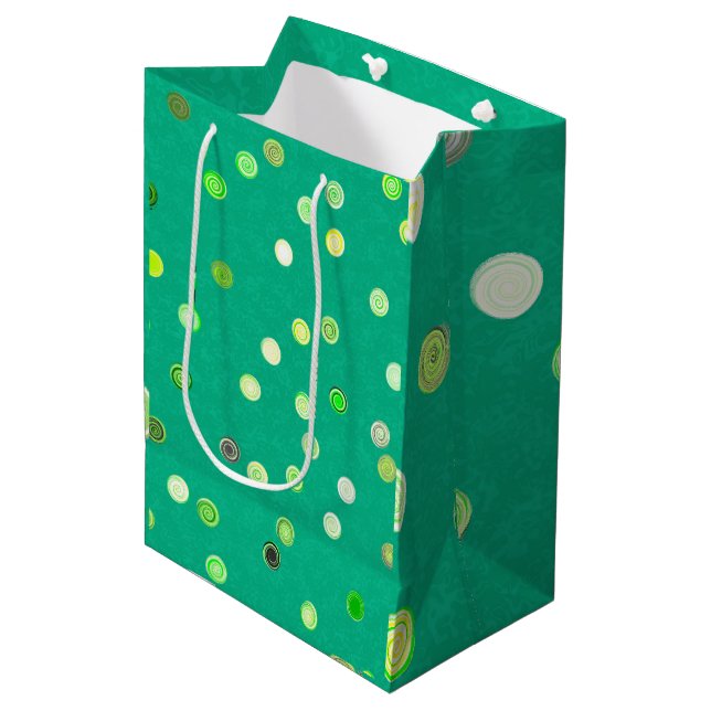 Drehende Spiralen mit Punkten Grün Geschenktüte (Vorderseite Schrägansicht)
