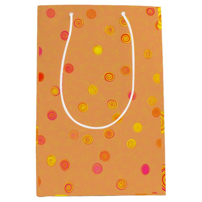 Drehende Spiralen mit Punkten Orange Geschenktüte (Vorderseite)