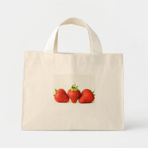 Drei Erdbeeren auf weißer Ebene Mini Stoffbeutel