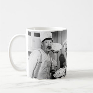 Drei Köche, die Kuchen für einen Kämpfen in der Kü Kaffeetasse