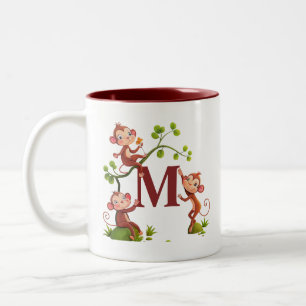 Drei niedliche Affen und marineblaue Monogramm-Tas Zweifarbige Tasse