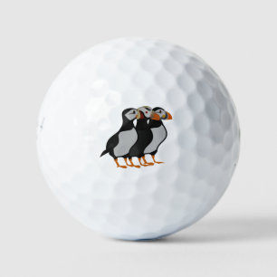 Drei schöne Puffin Stehender Cartoon Golfball