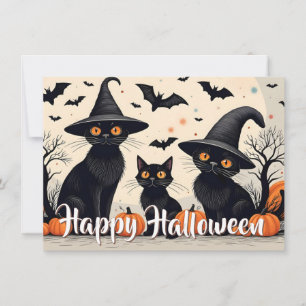 Drei schwarze Katzen mit Hüten an Halloween