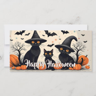 Drei schwarze Katzen zu Halloween