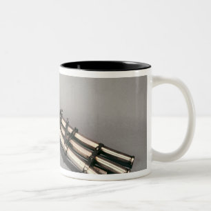 Dreifach-barrelled Pistole Zweifarbige Tasse
