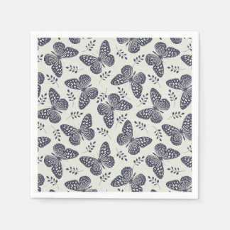 Dunkelblaues Schmetterlingsmuster auf grauem Hinte Serviette