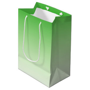 Dunkelgrüne bis leicht grüne Geschenktüte