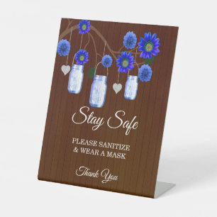 Dunkle rustikale blaue Flora Mason Jar Hochzeitsic Sockelschild