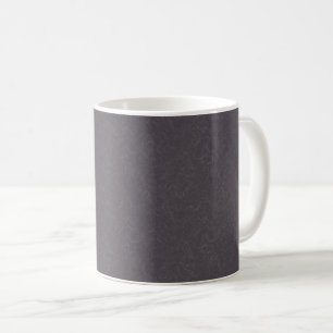 Dunkle violette texturierte Oberfläche mit wirbeln Kaffeetasse