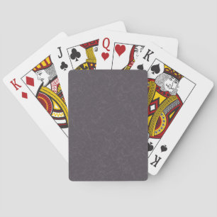 Dunkle violette texturierte Oberfläche mit wirbeln Spielkarten