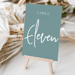 Dusty Aquamarin Hand Scripted Table ELEVEN Tischnummer<br><div class="desc">Einfache und schicke Tischnummer-Karten in staubigen aquamarinen Aqua und Weiß machen eine elegante Aussage bei Ihrer Hochzeit oder Veranstaltung. Das Design bietet "table [number]" in einem spannenden Mix aus klassischen Serifen und handgeschriebenen Skripten. Design wiederholt sich auf beiden Seiten. Einzelne nummerierte Karten werden separat verkauft; bestellen Sie jede Tischnummer einzeln...</div>
