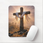Easter Crosses On a Hill Mousepad<br><div class="desc">A central wooden cross, covered with a white cloth and illuminated by the warm glow of the setting sun, stands out against two additional crosses on a rocky hillside in the background</div>