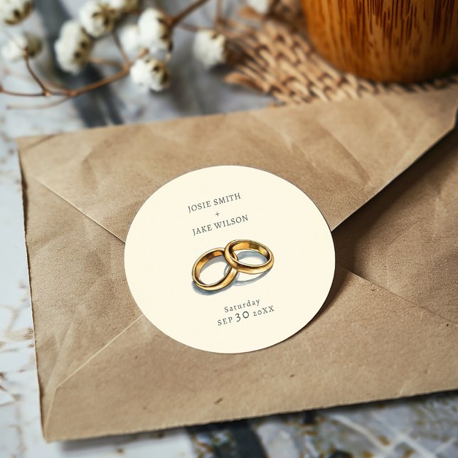 Eheschließungsringe Runder Aufkleber (Delicate gold rings on a muted background sticker, evoking elegance and serene romance for weddings.)