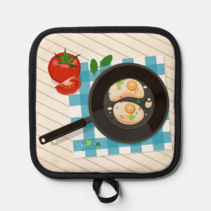 Eierspeisen in Pfanne mit Tomaten und Grüntöne Topflappen