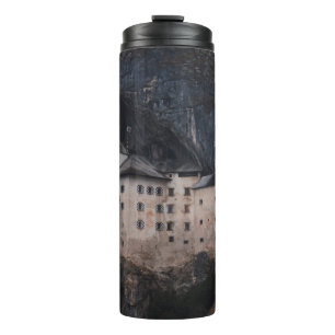 EIGE UND SCHWARZES KONKRETES HAUS THERMOSBECHER