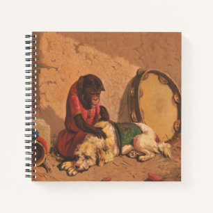Ein Affe und ein Hund mit einer großen Tambourine Notizbuch