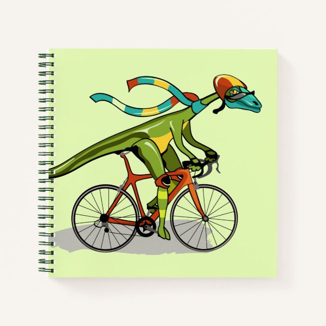 Ein Anabisetia Dinosaurier, der mit dem Fahrrad fä Notizbuch (Vorderseite)