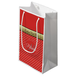 Ein angepasster roter Polka-Dot, goldenes Band Kleine Geschenktüte