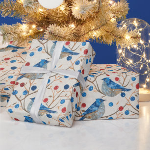 Ein blauer Vogel sitzt auf einem Zweig mit roten B Geschenkpapier