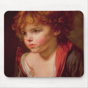 Ein blonder behaarter Junge mit einem offenen Mousepad
